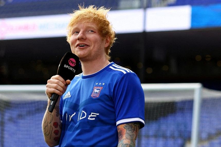 Pop-star Ed Sheeran plays a crucial role in sealing Ipswich transfer deal